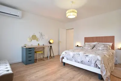 Un ou plusieurs lits dans un hébergement de l'établissement Cozy appartement