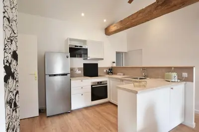 Cuisine ou kitchenette dans l'établissement Cozy appartement