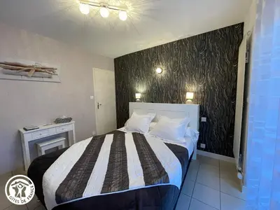 Un ou plusieurs lits dans un hébergement de l'établissement Chambres d'hôtes Le Cerisier