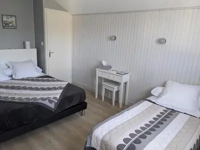 Un ou plusieurs lits dans un hébergement de l'établissement Chambres d'hôtes Le Cerisier