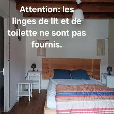 Un ou plusieurs lits dans un hébergement de l'établissement Charmante maison de village 30 min Puy DuFou