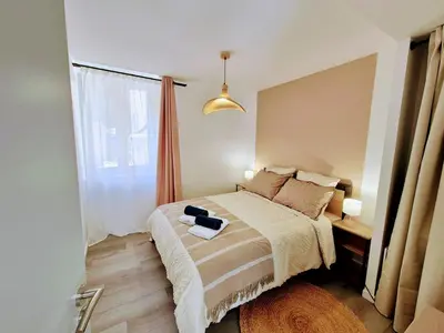 Un ou plusieurs lits dans un hébergement de l'établissement Appartement 