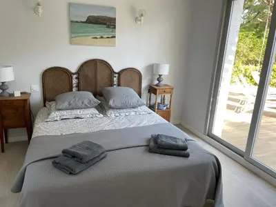 Un ou plusieurs lits dans un hébergement de l'établissement Villa La Dune aux Loups