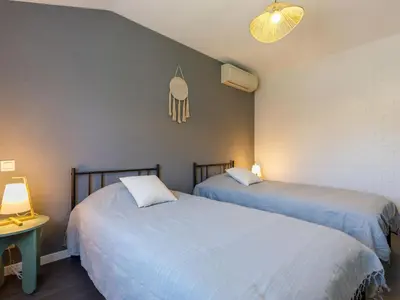 Un ou plusieurs lits dans un hébergement de l'établissement Holiday Home Villa Sunset by Interhome