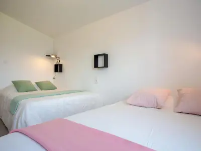 Un ou plusieurs lits dans un hébergement de l'établissement Holiday Home L'Effet Mer by Interhome