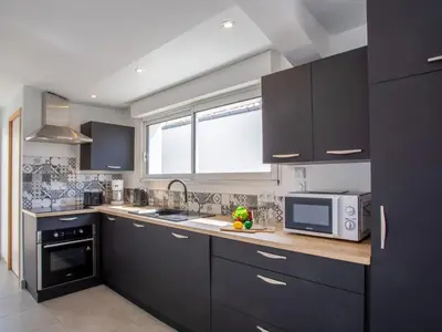 Cuisine ou kitchenette dans l'établissement Holiday Home L'Effet Mer by Interhome