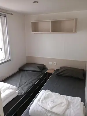 Un ou plusieurs lits dans un hébergement de l'établissement Mobilhome L'abri Côtier