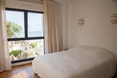 Un ou plusieurs lits dans un hébergement de l'établissement Villa avec vue mer, accès plage à 2 minutes à pied