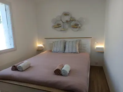 Un ou plusieurs lits dans un hébergement de l'établissement Le Cocon - cosy et tout à pied