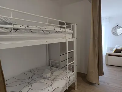 Un ou plusieurs lits dans un hébergement de l'établissement Le Cocon - cosy et tout à pied