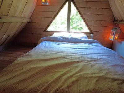 Un ou plusieurs lits dans un hébergement de l'établissement La Maison Magique