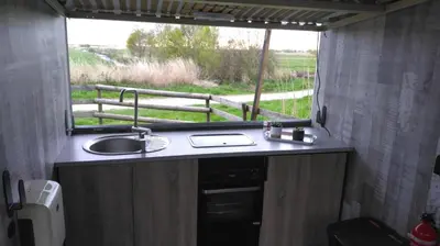 Cuisine ou kitchenette dans l'établissement Les pêcheries Jumelles