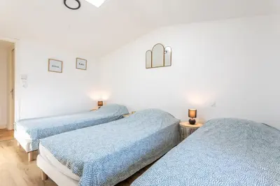 Un ou plusieurs lits dans un hébergement de l'établissement Gîte Milena - SPA - Puy duFou - Grande capacité