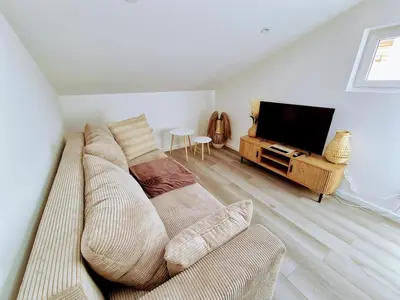 Télévision ou salle de divertissement dans l'établissement Appartement 