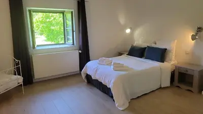 Un ou plusieurs lits dans un hébergement de l'établissement La Treille - Grand jardin avec Piscine & Tennis