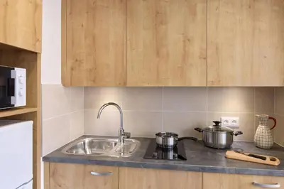 Cuisine ou kitchenette dans l'établissement Quality Aparthotel Cholet