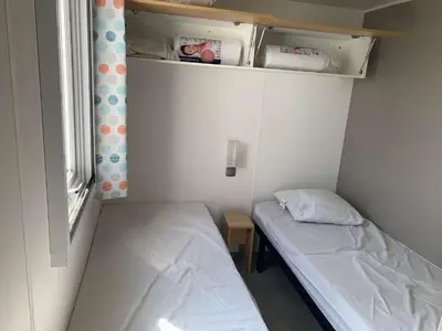 Un ou plusieurs lits dans un hébergement de l'établissement Le parc des roselieres 40 Saint Hilaire de Riez
