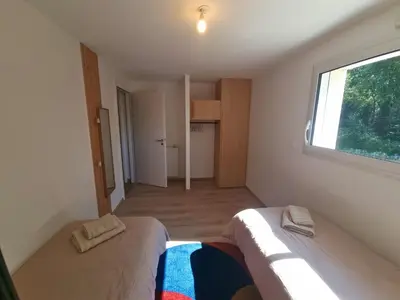 Un ou plusieurs lits dans un hébergement de l'établissement Maison Cosy T4 proche de la mer