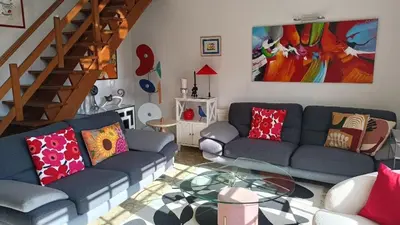 Coin salon dans l'établissement VILLA 5 CHAMBRES 10 PERSONNES 300m PLAGE DEMOISELLE