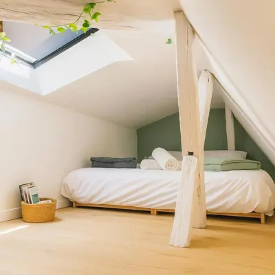 Un ou plusieurs lits dans un hébergement de l'établissement Studio Cosy ambiance Tiny House