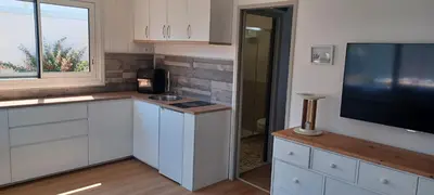 Cuisine ou kitchenette dans l'établissement CHALET en bois à 600 m de la plage