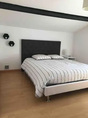 Un ou plusieurs lits dans un hébergement de l'établissement Maison de charme 18e entre mer et campagne