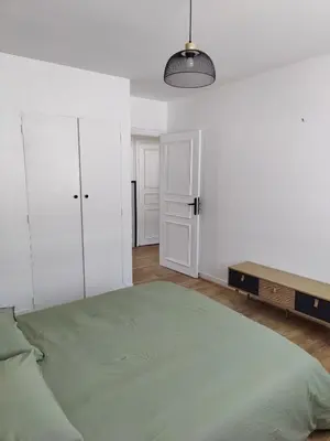 Un ou plusieurs lits dans un hébergement de l'établissement T4 coeur de ville, à deux pas de la plage - 3 chambres