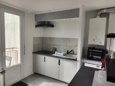 Cuisine ou kitchenette dans l'établissement T4 coeur de ville, à deux pas de la plage - 3 chambres