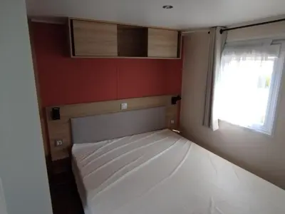 Un ou plusieurs lits dans un hébergement de l'établissement Mobil-home 40m2