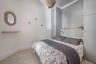 Un ou plusieurs lits dans un hébergement de l'établissement Appart-patio Centre-ville à 100m de la plage