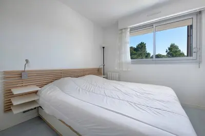 Un ou plusieurs lits dans un hébergement de l'établissement Face Mer, appartement pour 4 personnes