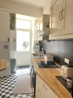 Cuisine ou kitchenette dans l'établissement Gare - Visitation grand Appartement , 1 chambre