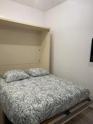 Un ou plusieurs lits dans un hébergement de l'établissement Studio cosy et indépendant - idéal pour 2 personnes