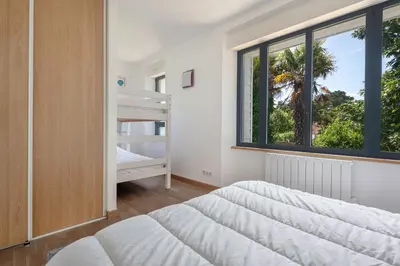 Un ou plusieurs lits dans un hébergement de l'établissement Villa pour 15 à 700m de la plage