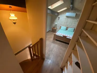 Un ou plusieurs lits dans un hébergement de l'établissement Maison charme à Mauléon avec jardin privé