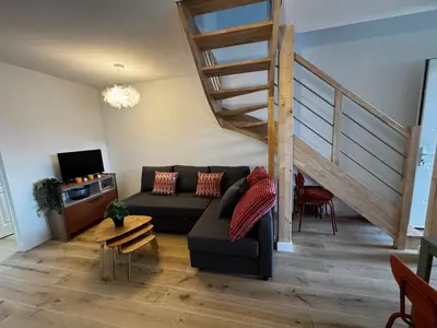 Coin salon dans l'établissement Maison pilotis 6 pers 50m mer
