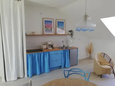 Cuisine ou kitchenette dans l'établissement La mansarde