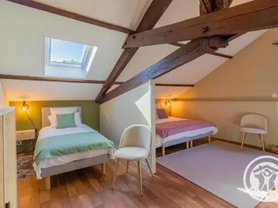 Un ou plusieurs lits dans un hébergement de l'établissement Gîte spacieux de 8 chambres au cœur des vignes d'Anjou - FR-1-622-112
