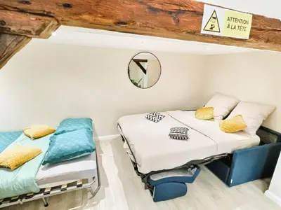 Un ou plusieurs lits dans un hébergement de l'établissement Studio cosy refait à neuf - proche aéroport et tram