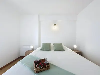 Un ou plusieurs lits dans un hébergement de l'établissement Apartment Les Roches by Interhome