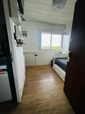 Un ou plusieurs lits dans un hébergement de l'établissement Studio Lumineux en Bord de Mer