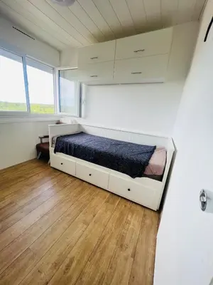 Un ou plusieurs lits dans un hébergement de l'établissement Studio Lumineux en Bord de Mer