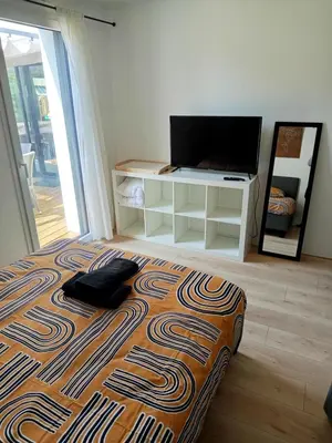 Un ou plusieurs lits dans un hébergement de l'établissement Zéphyr - Maison 3 Chambres avec jacuzzi - Proche aéroport et Nantes
