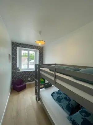 Un ou plusieurs lits dans un hébergement de l'établissement Maison 3 chambres 4 minutes du Puy