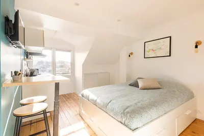 Un ou plusieurs lits dans un hébergement de l'établissement Studio Bel Ami - Nantes centre ville