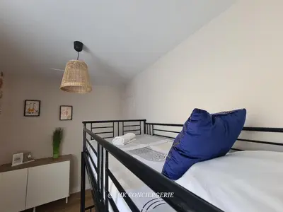 Un ou plusieurs lits dans un hébergement de l'établissement Maison du Puy avec jardin clos, 4 min Puy duFou