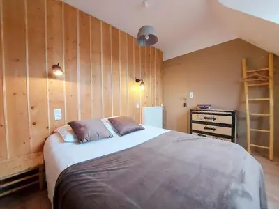 Un ou plusieurs lits dans un hébergement de l'établissement La Maison Bleue