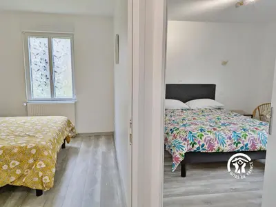 Un ou plusieurs lits dans un hébergement de l'établissement Gîte du Hérisson, 6 personnes