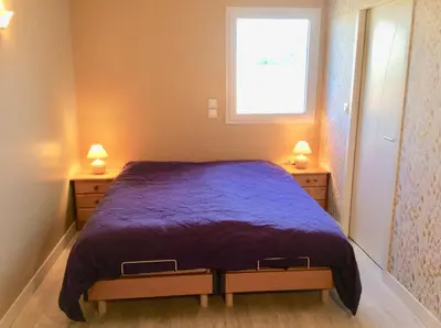 Un ou plusieurs lits dans un hébergement de l'établissement Maison 6 personnes très ensoleillée