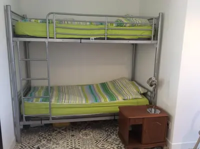 Un ou plusieurs lits dans un hébergement de l'établissement Maison 6 personnes très ensoleillée